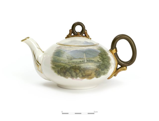 Belleek teapot decorated with scenes of Glendalough