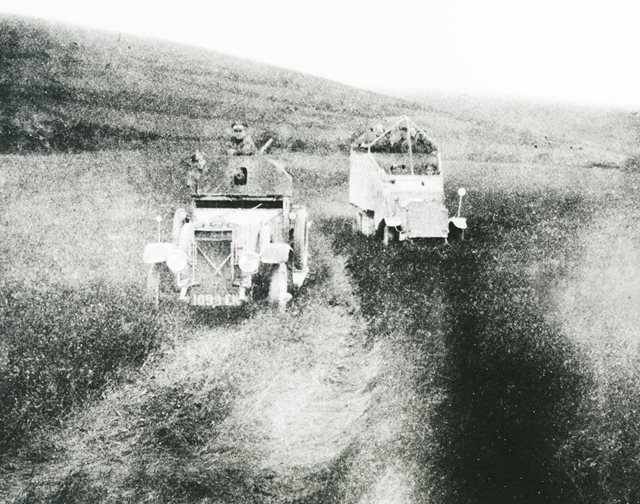 British officers in armoured car and Lancia cage car, 1920-1921